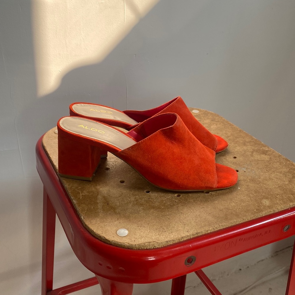 Also orange-red suede mules